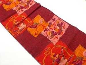 手織り真綿紬四角に抽象人物・壺・唐草模様織出し名古屋帯